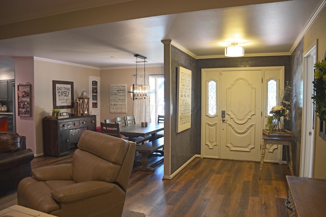 entrance foyer featuring crown molding, dark hardwood / wood-style flooring, and a notable chandelier