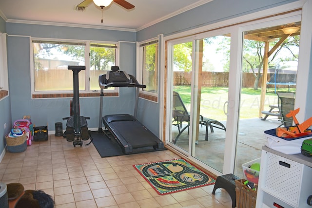 exercise room with a wealth of natural light, light tile patterned floors, ceiling fan, and crown molding