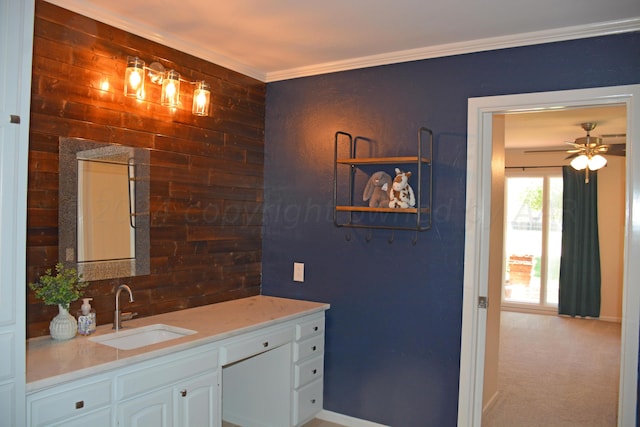 bathroom featuring vanity, ceiling fan, and crown molding