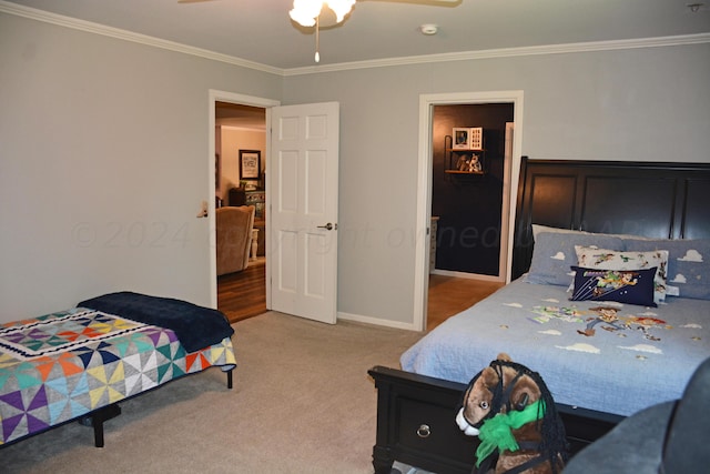 bedroom with carpet flooring, ceiling fan, and crown molding