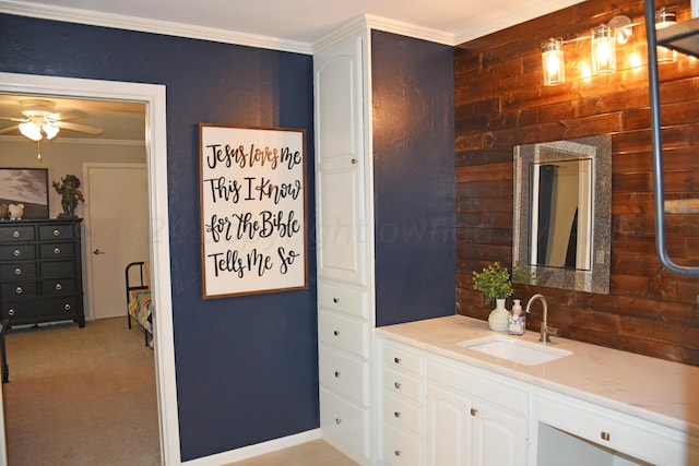 bathroom with ceiling fan, vanity, and crown molding