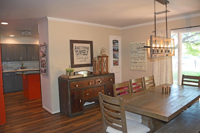 dining room featuring dark wood-type flooring and ornamental molding