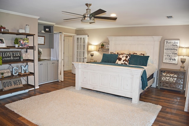 bedroom featuring dark hardwood / wood-style flooring, ceiling fan, and crown molding