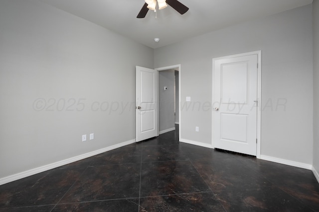 7602 Castleman Rd, Amarillo, TX 79119 - unfurnished bedroom featuring baseboards and a ceiling fan