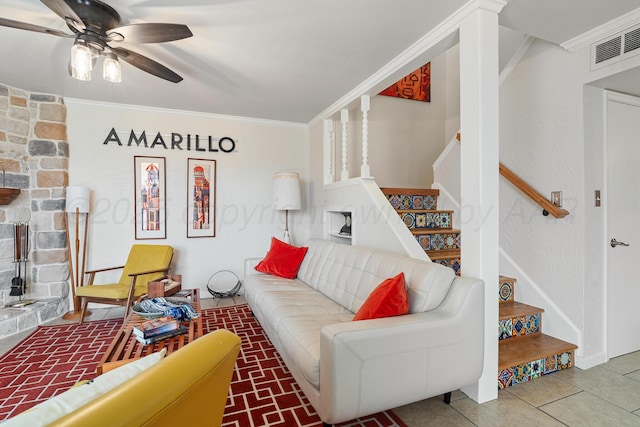 tiled living room featuring ornamental molding, visible vents, stairway, and a ceiling fan