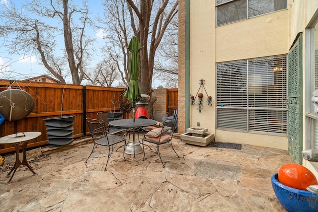 view of patio / terrace with a fenced backyard and outdoor dining space