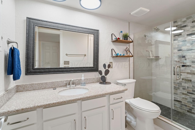 full bath with toilet, a shower stall, visible vents, and vanity