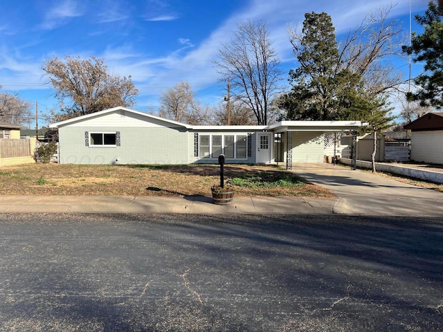 single story home featuring a carport