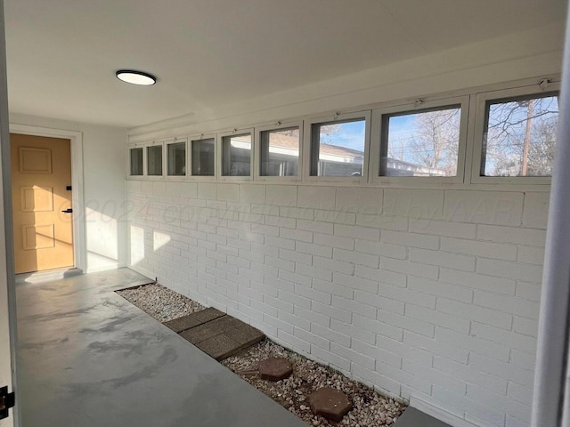 unfurnished sunroom featuring plenty of natural light