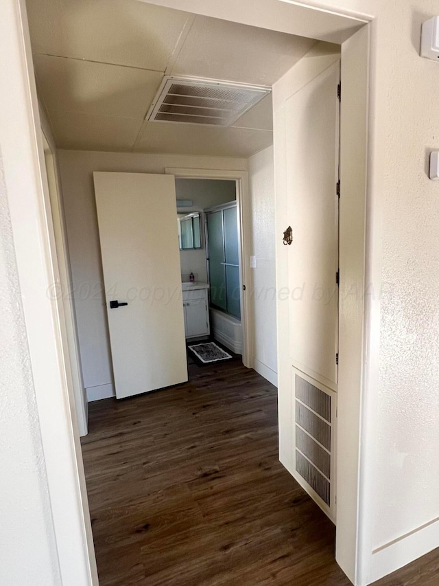 hallway featuring dark hardwood / wood-style floors