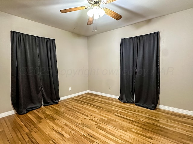 unfurnished room with ceiling fan and light wood-type flooring