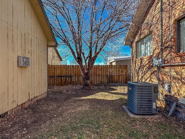 view of yard with central air condition unit