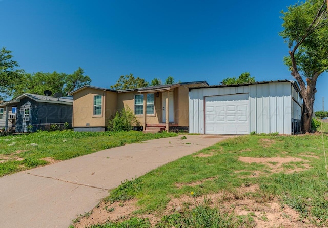 single story home featuring an attached garage, concrete driveway, and board and batten siding