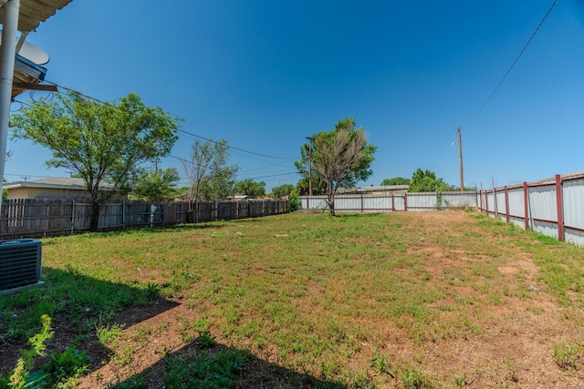 view of yard with central AC unit