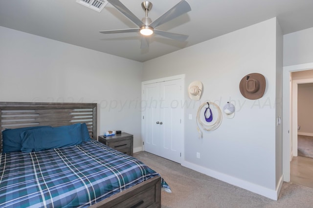 bedroom with carpet flooring, ceiling fan, and a closet