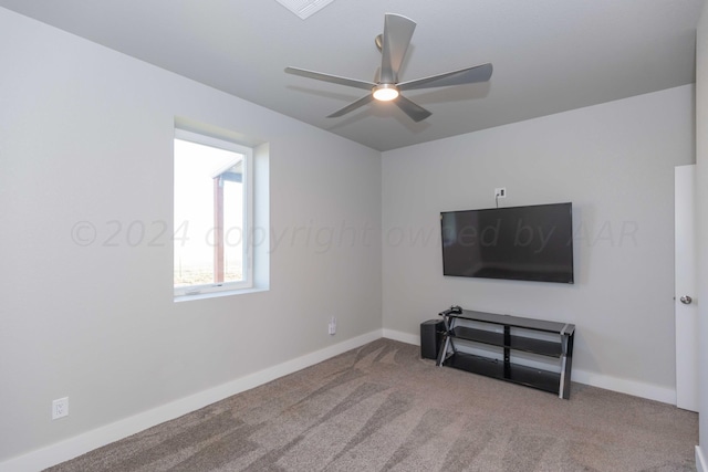 unfurnished living room with ceiling fan and carpet floors