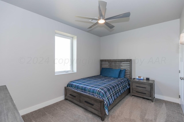 bedroom with light carpet and ceiling fan