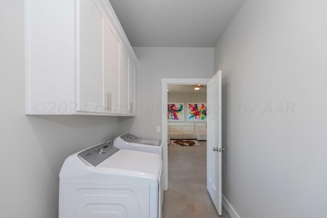 clothes washing area featuring cabinets, ceiling fan, and independent washer and dryer