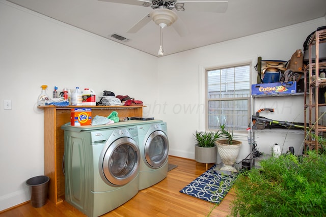 2402 S Hayden St, Amarillo, TX 79109 - laundry room with washing machine and dryer, a ceiling fan, and wood finished floors