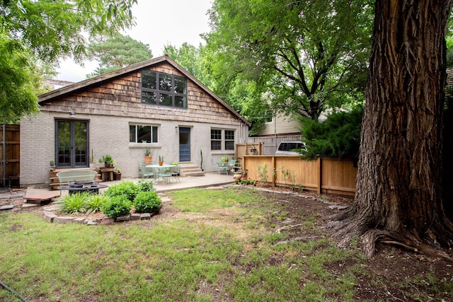 2402 S Hayden St, Amarillo, TX 79109 - back of property with entry steps, a patio, and brick siding