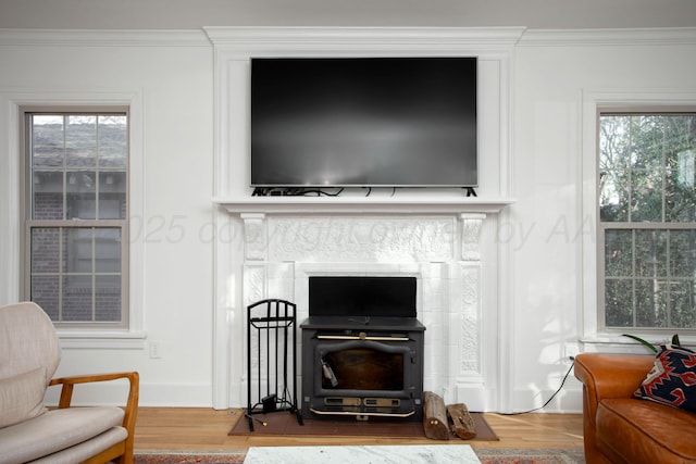2402 S Hayden St, Amarillo, TX 79109 - detailed view of wood finished floors, crown molding, and a wood stove