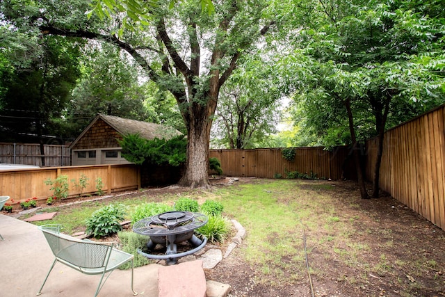 2402 S Hayden St, Amarillo, TX 79109 - fenced backyard featuring an outdoor fire pit