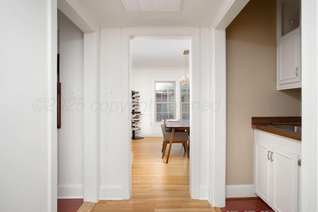 2402 S Hayden St, Amarillo, TX 79109 - hall featuring light wood-type flooring and baseboards