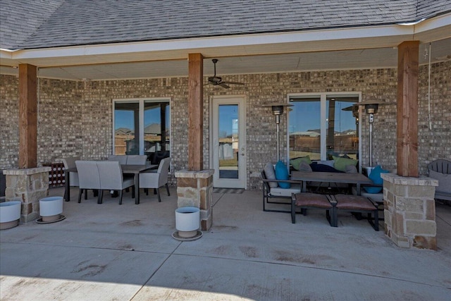 view of patio with outdoor dining space and ceiling fan