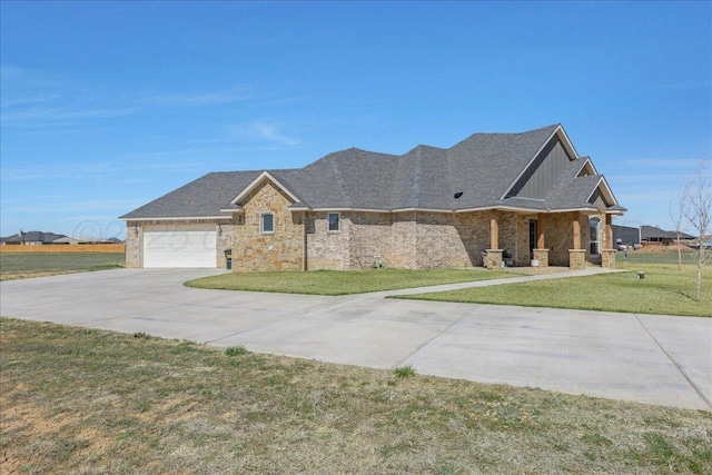 ranch-style house featuring an attached garage, driveway, stone siding, and a front lawn