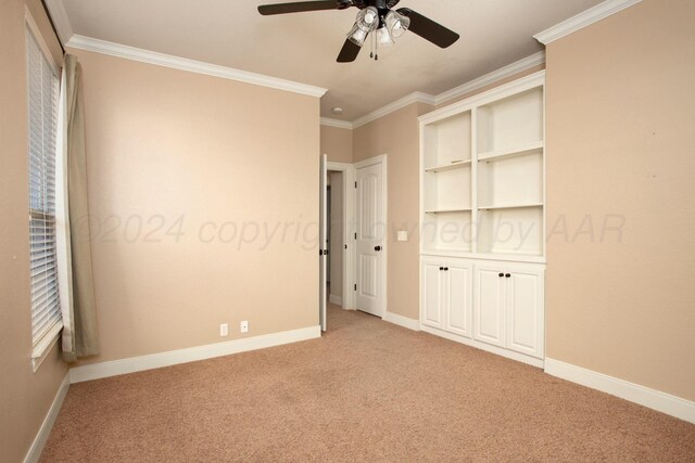 unfurnished bedroom with light carpet, baseboards, crown molding, and ceiling fan