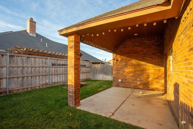 view of patio / terrace featuring fence
