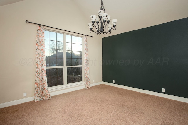 spare room featuring carpet, baseboards, and an inviting chandelier