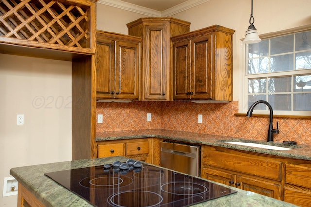 kitchen with dark stone countertops, crown molding, backsplash, brown cabinetry, and a sink
