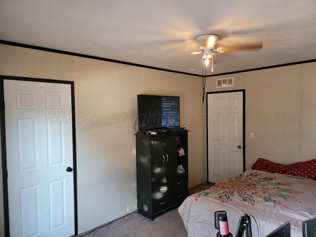 bedroom with ceiling fan and carpet