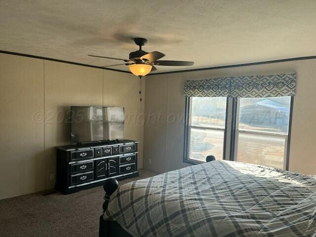 bedroom with ceiling fan and carpet