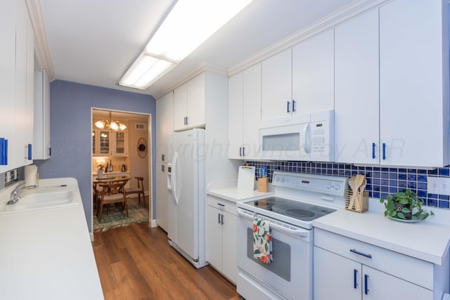 1506 S Alabama St, Amarillo, TX 79102 - kitchen featuring white appliances, a sink, light countertops, wood finished floors, and white cabinetry