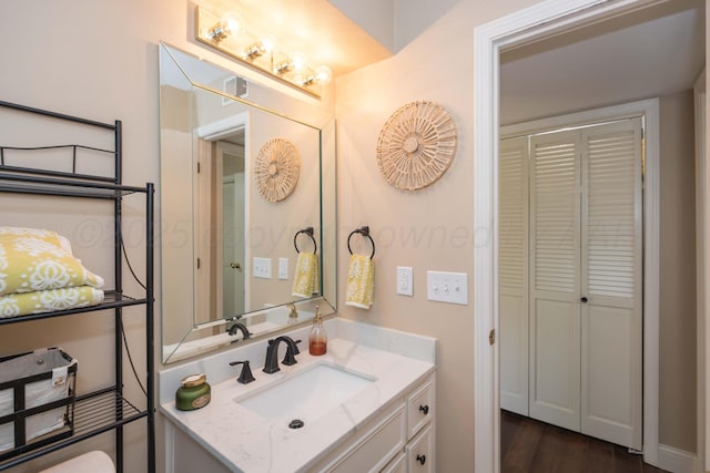 1506 S Alabama St, Amarillo, TX 79102 - bathroom with vanity, a closet, and wood finished floors