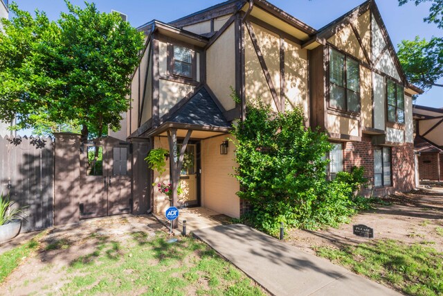 1506 S Alabama St, Amarillo, TX 79102 - view of front of property featuring stucco siding, brick siding, and a gate