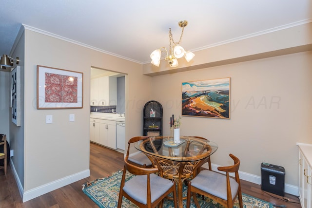 1506 S Alabama St, Amarillo, TX 79102 - dining space with a chandelier, ornamental molding, dark wood-style flooring, and baseboards