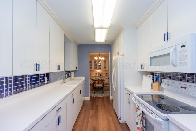 1506 S Alabama St, Amarillo, TX 79102 - kitchen with white appliances, a sink, tasteful backsplash, light countertops, and dark wood-style floors