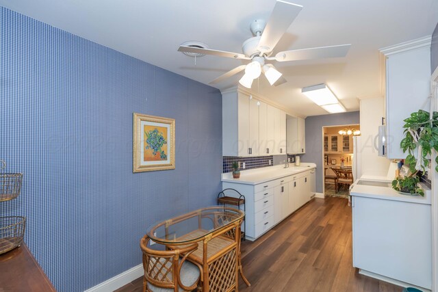 1506 S Alabama St, Amarillo, TX 79102 - kitchen with light countertops, a sink, dark wood finished floors, ceiling fan, and a chandelier
