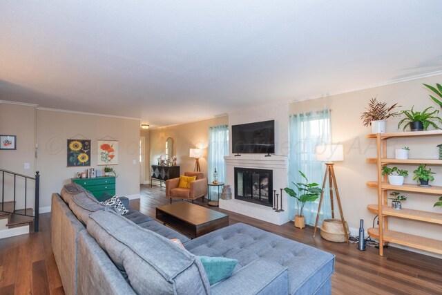 1506 S Alabama St, Amarillo, TX 79102 - living room featuring wood finished floors, baseboards, a large fireplace, and ornamental molding
