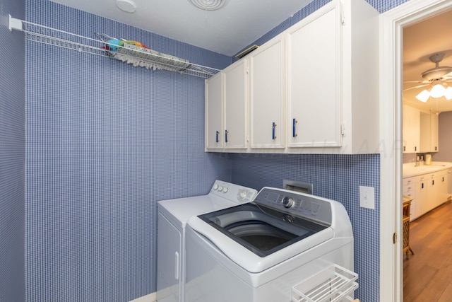 1506 S Alabama St, Amarillo, TX 79102 - washroom featuring cabinet space, independent washer and dryer, wood finished floors, and a ceiling fan