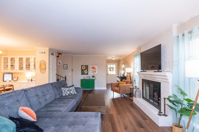 1506 S Alabama St, Amarillo, TX 79102 - living room with wood finished floors, a fireplace, and ornamental molding
