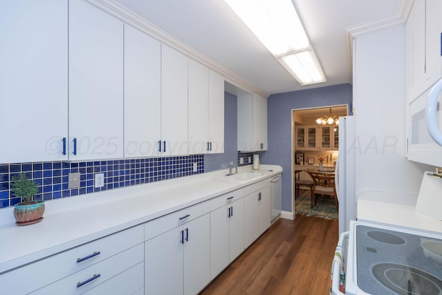 1506 S Alabama St, Amarillo, TX 79102 - kitchen featuring light countertops, a chandelier, dark wood-type flooring, decorative backsplash, and white cabinetry