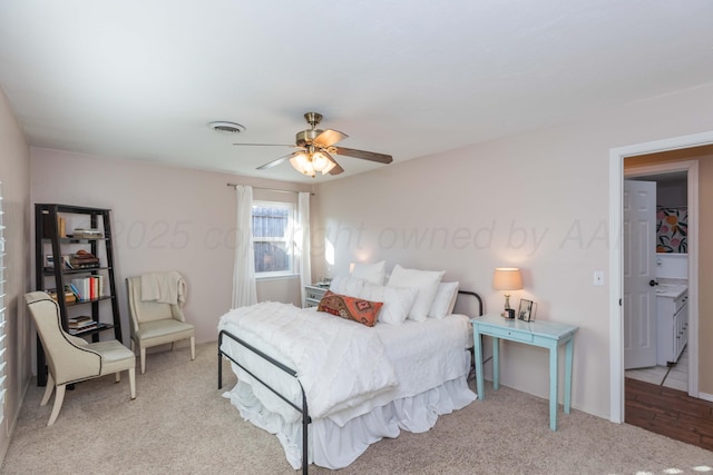 bedroom with visible vents, ceiling fan, and carpet floors