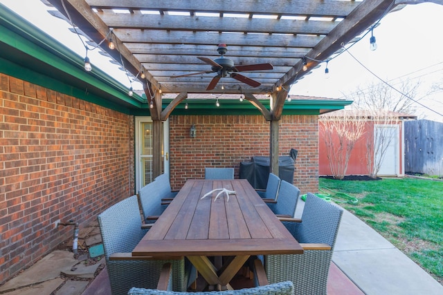 view of patio featuring a ceiling fan, outdoor dining space, a pergola, and fence