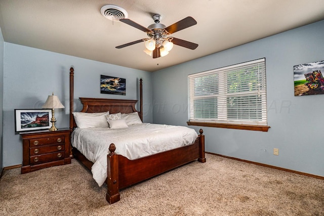 7503 Elmhurst Dr, Amarillo, TX 79121 - carpeted bedroom with baseboards and ceiling fan