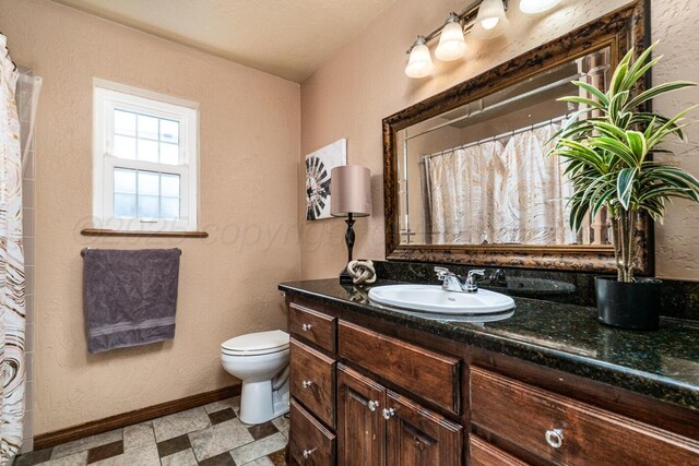 7503 Elmhurst Dr, Amarillo, TX 79121 - full bath featuring vanity, a textured wall, and a shower with curtain