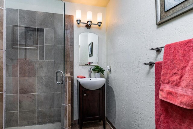 7503 Elmhurst Dr, Amarillo, TX 79121 - bathroom featuring vanity and a stall shower